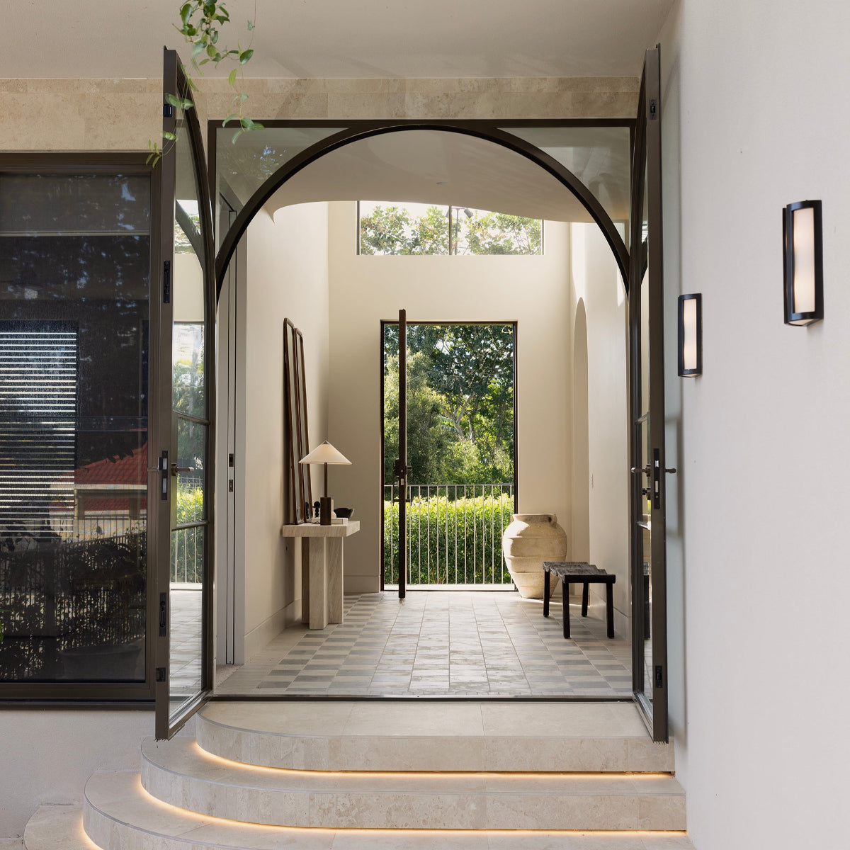 Orlando teak bench and pot in entryway by Ocean Luxe