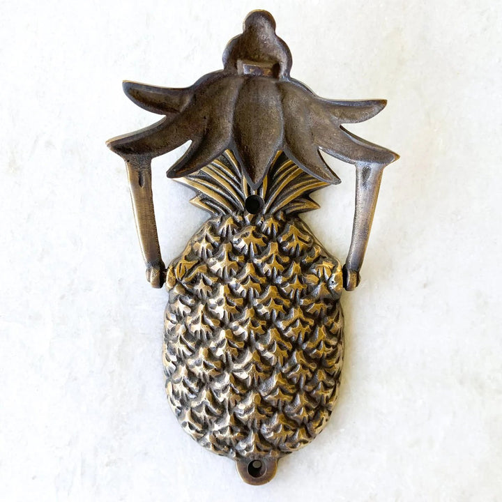 Antique Brass Pineapple Door Knocker with knocker plate raised by Ocean Luxe